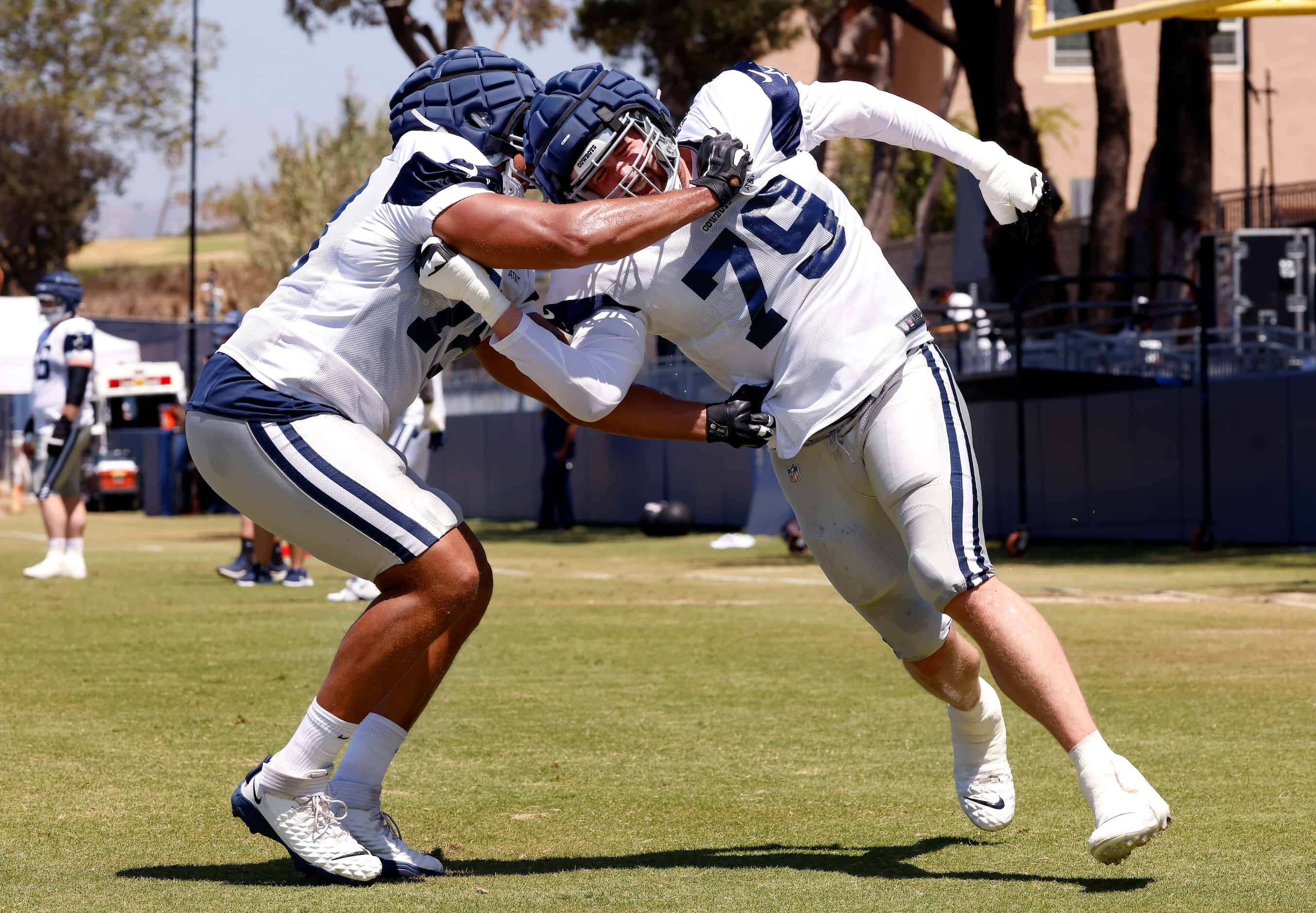 Dallas Cowboys offensive tackles Matt Waletzko (79) gets an arm under Terence Steele (78) as...