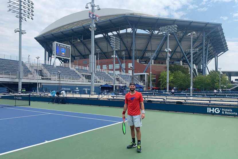 Nate Lammons stands out on a U.S. Open court, donning an SMU shirt. He's standing in front...
