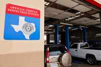 An official vehicle inspection station sign is seen on the wall at Town East Automotive,...