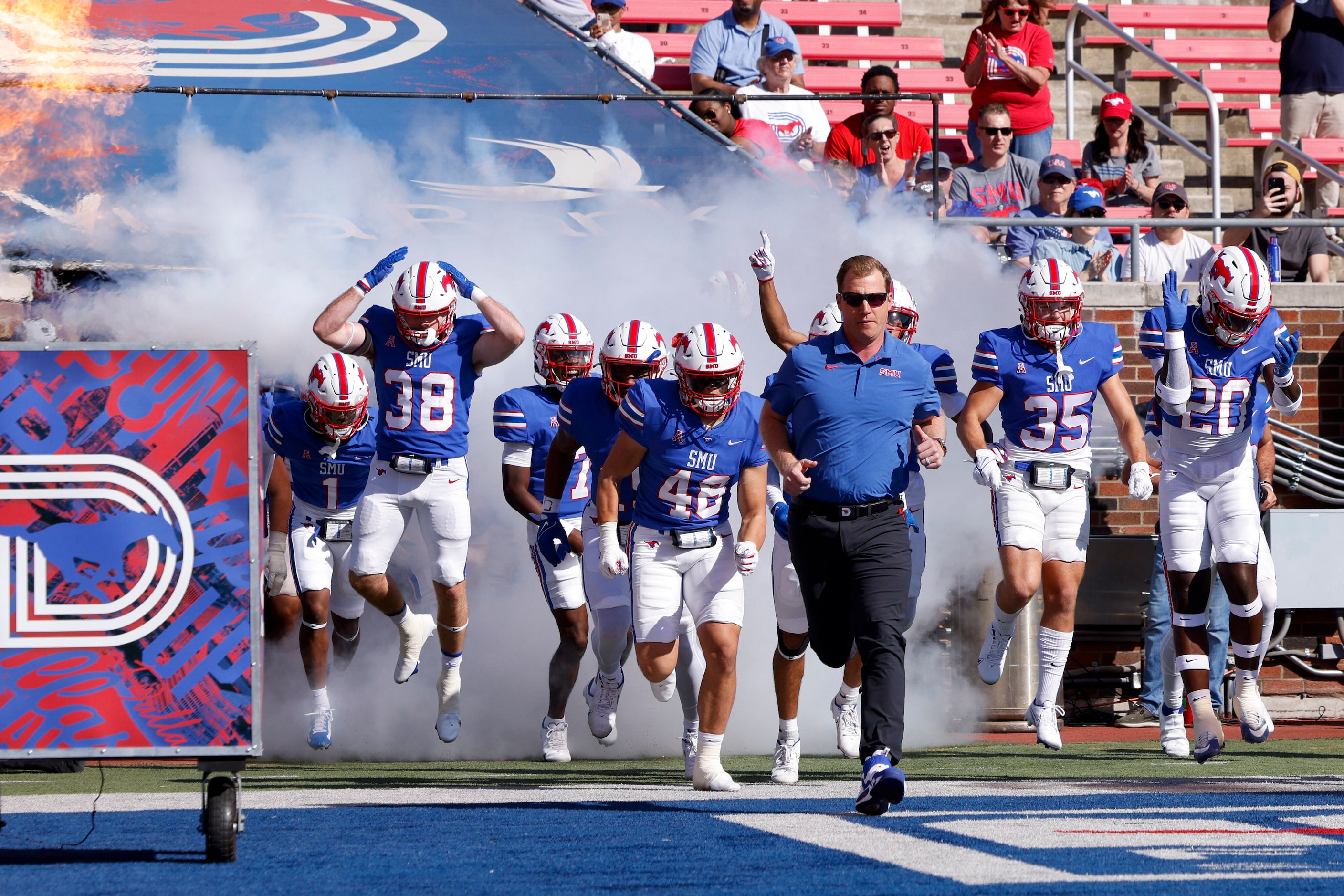 SMU head coach Rhett Lashlee leads the team onto the field before an NCAA football game...