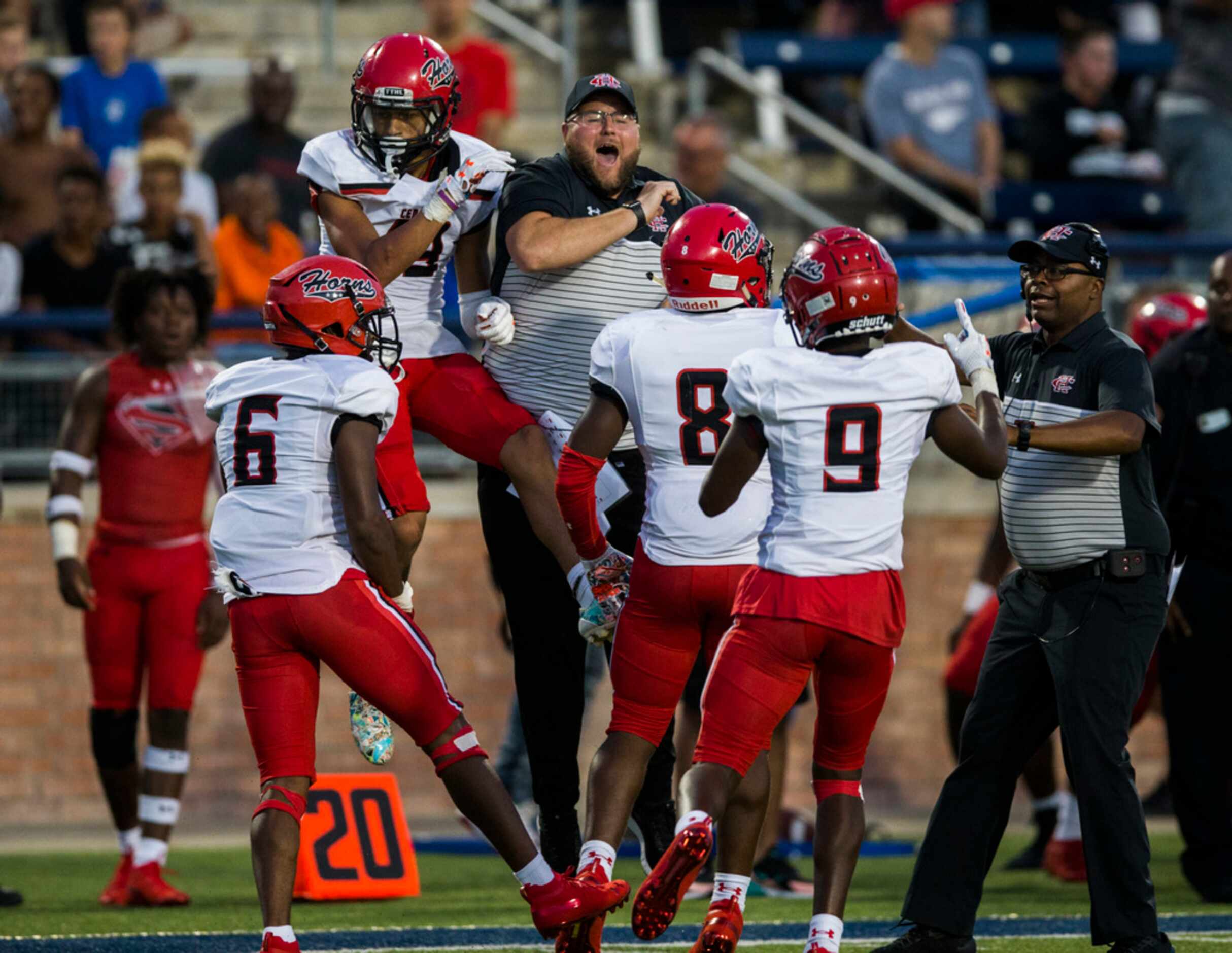 Cedar Hill cornerback Jalon Peoples (19) celebrates after an interception in the end zone...