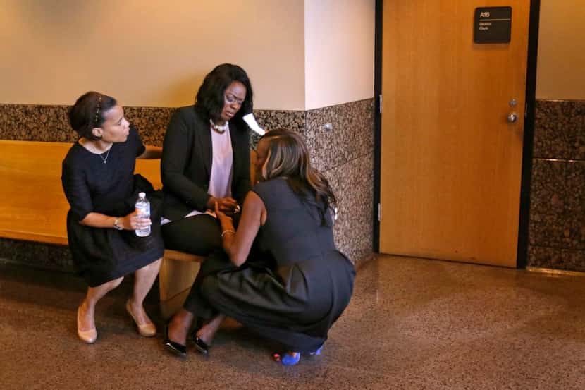 Tammy Simpson,  mother of Troy Causey Jr., was consoled by sister Keshia Hawkins (right) and...