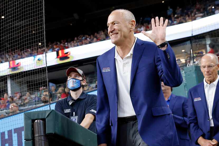 Texas Rangers Baseball Hall of Fame member Eric Nadel waves to the crowd as he's introduced...