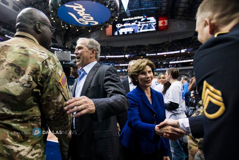 George W. Bush and Laura Bush greet soldiers at the Dallas Mavericks' annual Seats for...