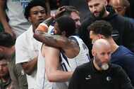 Dallas Mavericks guard Luka Doncic hugs guard Kyrie Irving after a victory over the Oklahoma...
