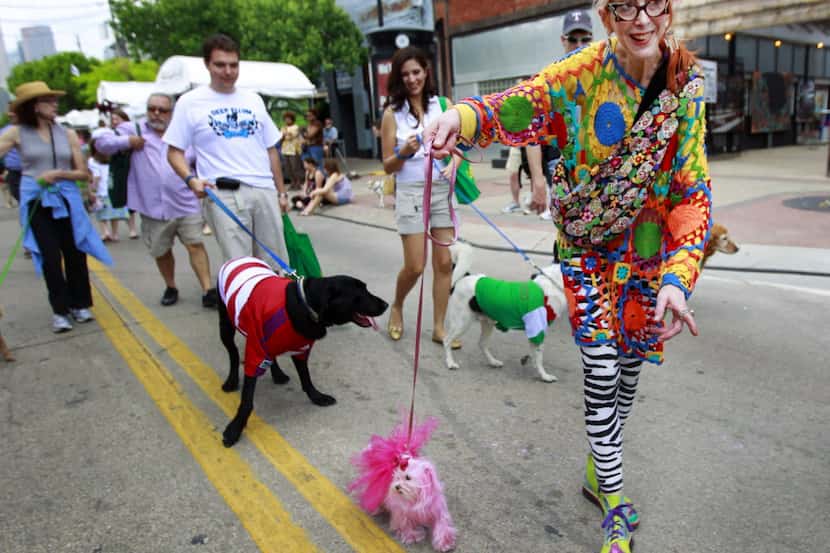 Crowds flock to the  Deep Ellum Arts Festival's dog parade, a festival tradition.