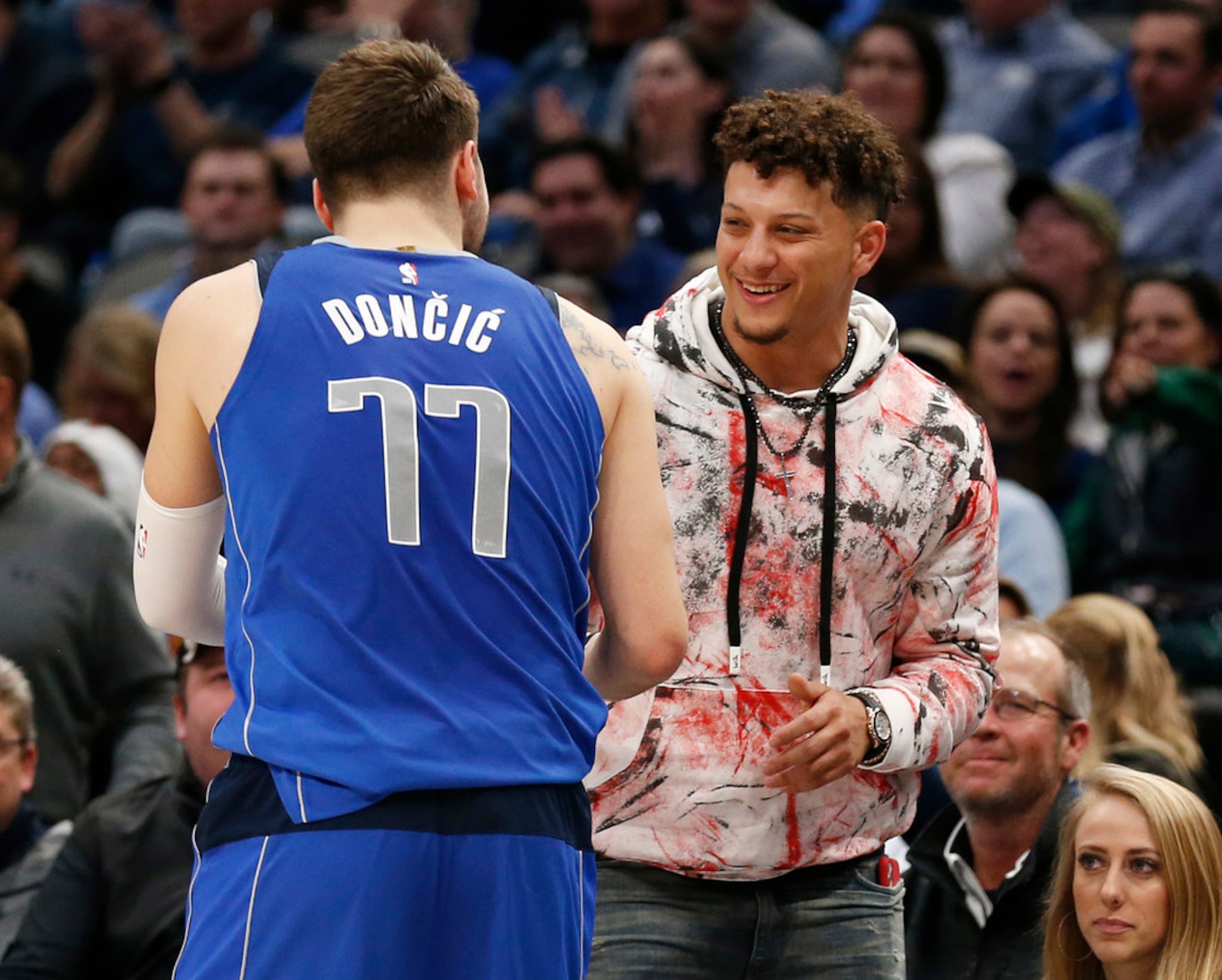 Dallas Mavericks guard Luka Doncic (77) greets Kansas City Chiefs Patrick Mahomes during a...