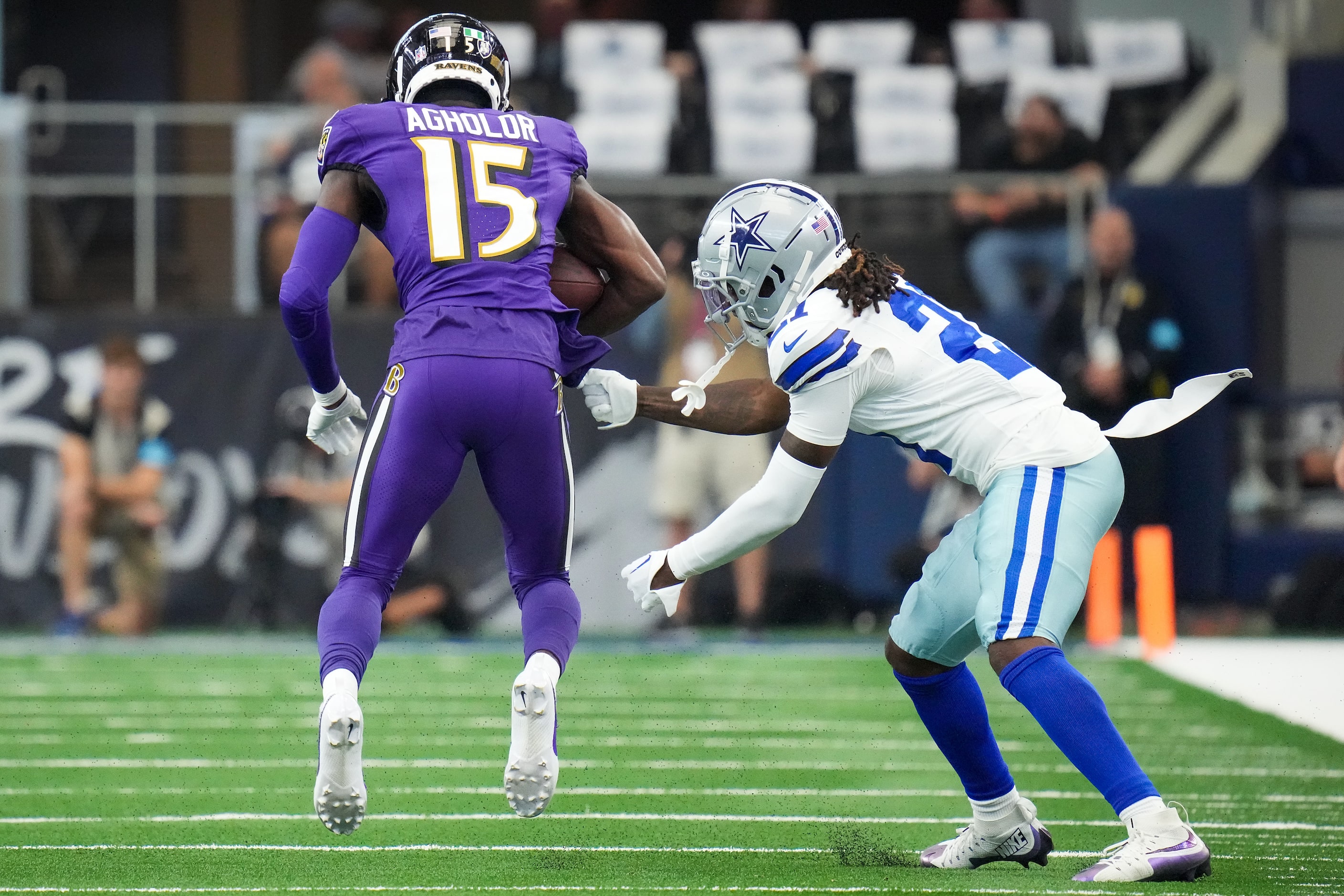 Baltimore Ravens wide receiver Nelson Agholor (15) breaks away from Dallas Cowboys...