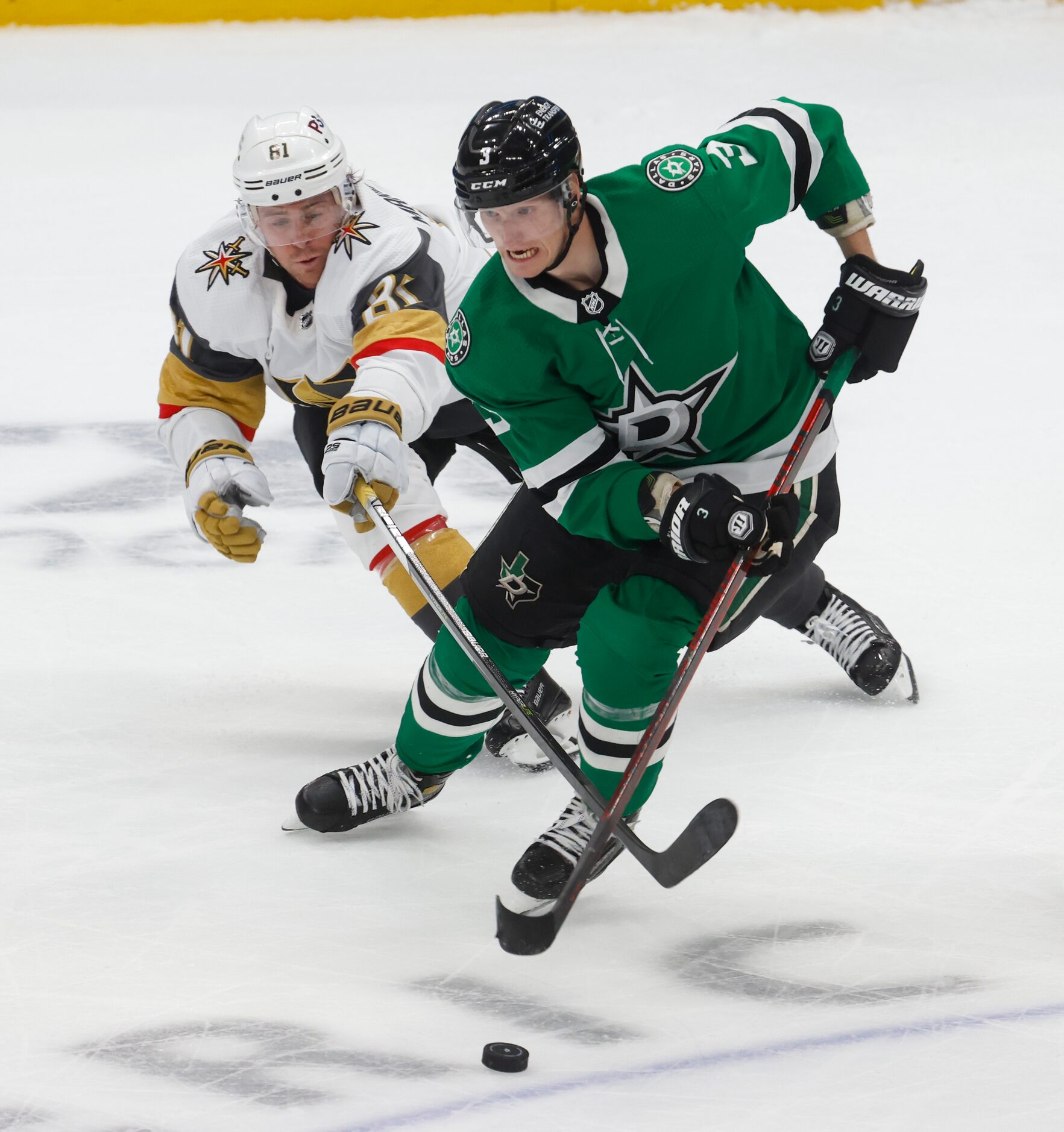 Dallas Stars defenseman John Klingberg (3) keeps the puck from Vegas Golden Knights center...