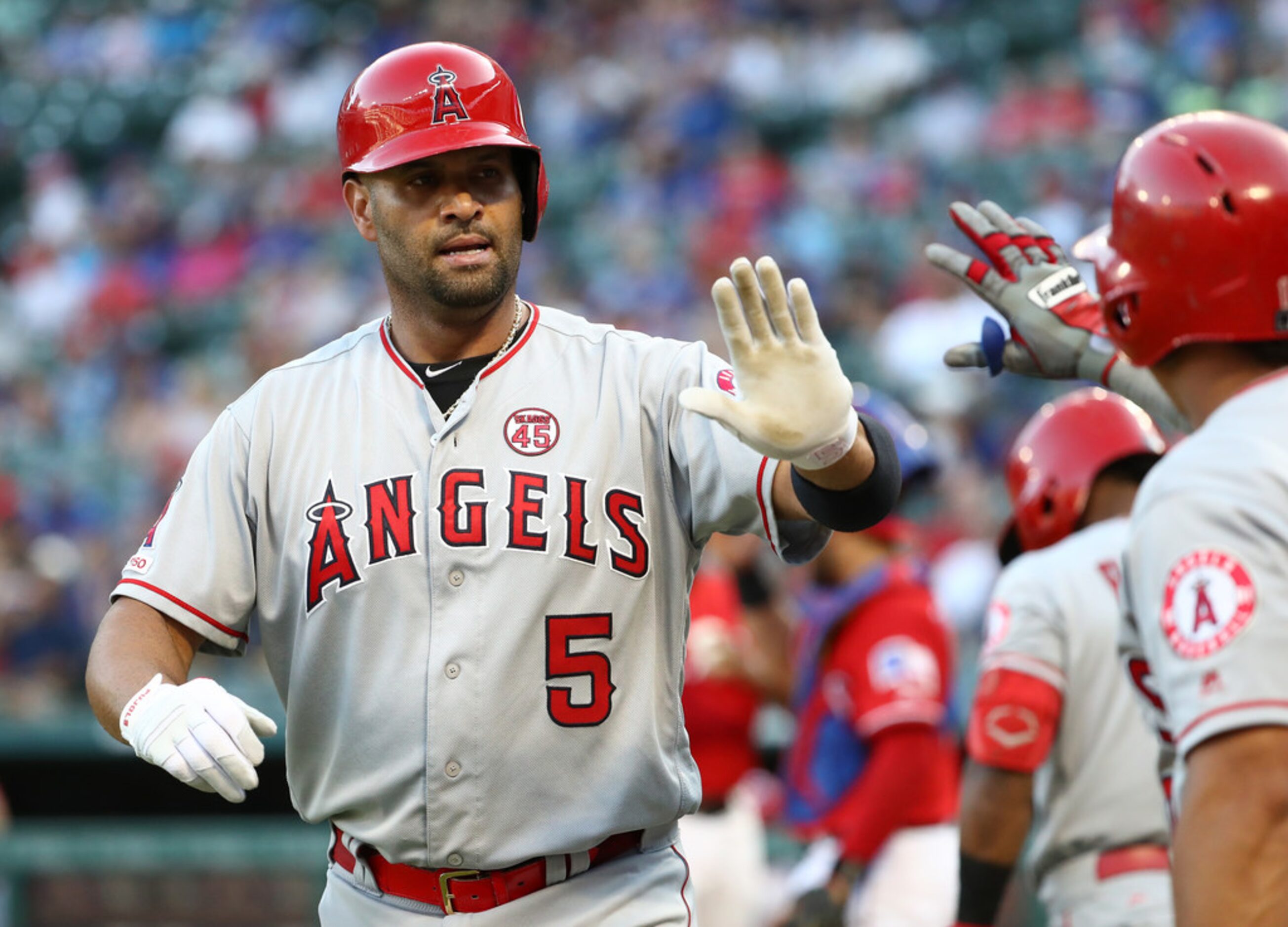 ARLINGTON, TEXAS - AUGUST 19:  Albert Pujols #5 of the Los Angeles Angels celebrates a...