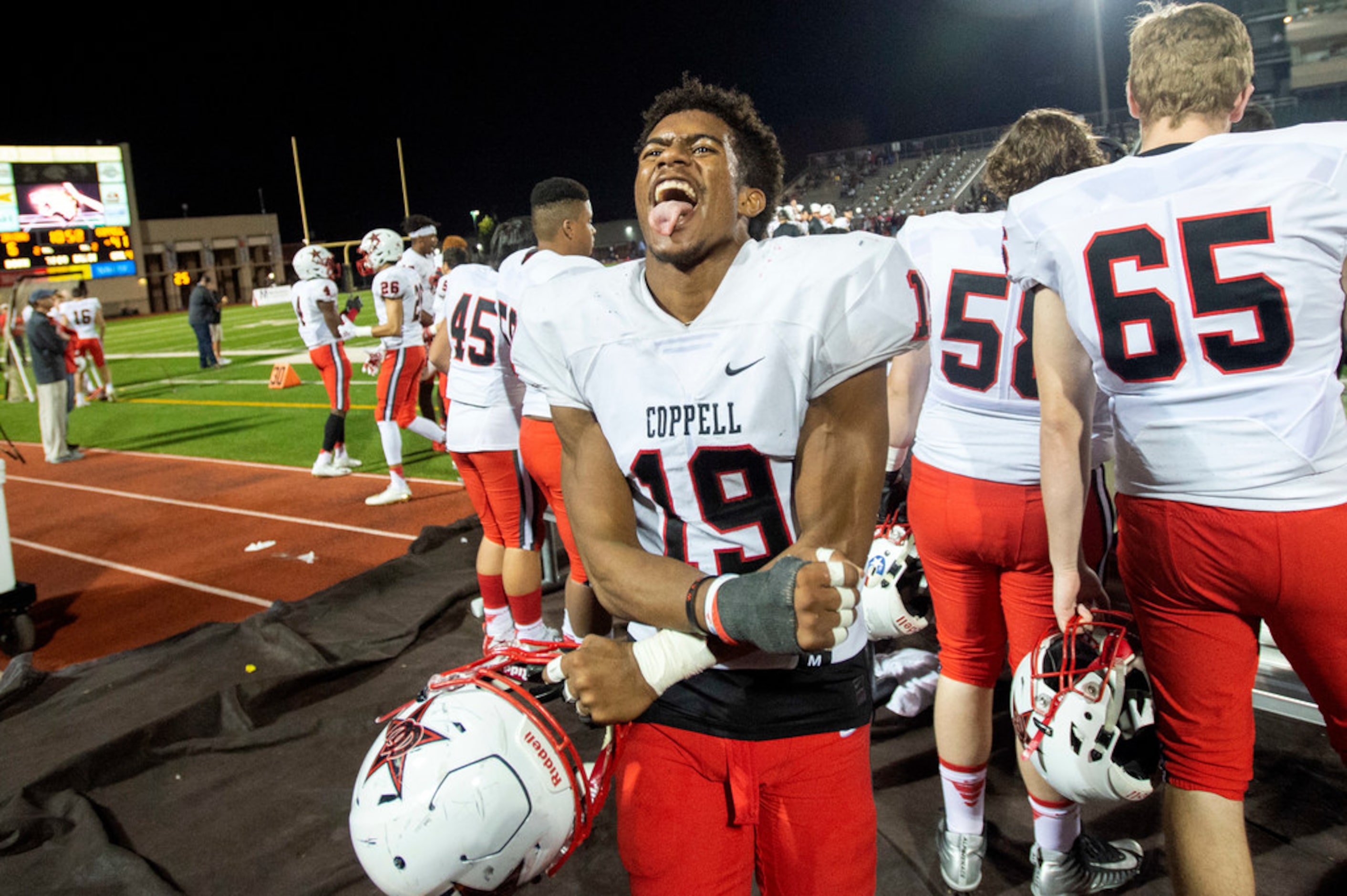 Coppell senior linebacker Xavier Brown (19) gets hyped on the sidelines during the second...