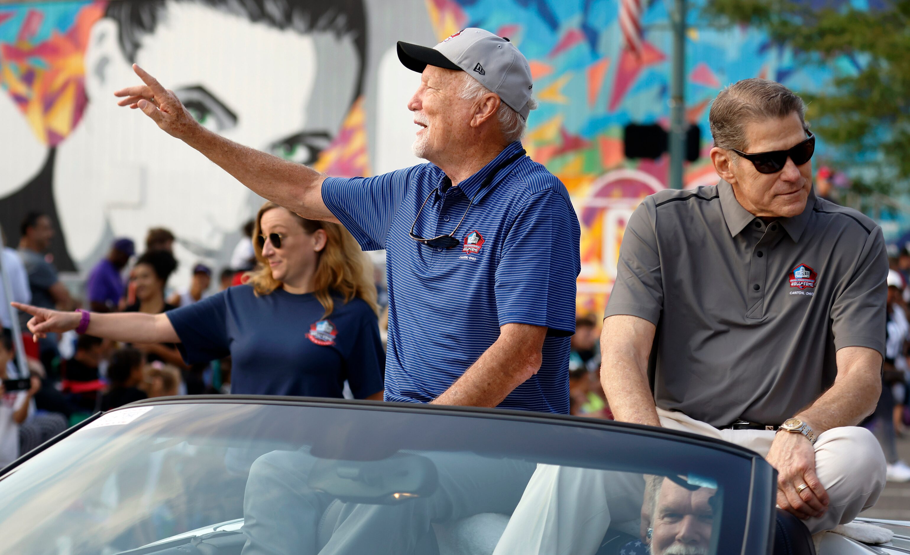 Dallas Cowboys Pro Football Hall of Fame inductee Cliff Harris (left) waves to fans along...