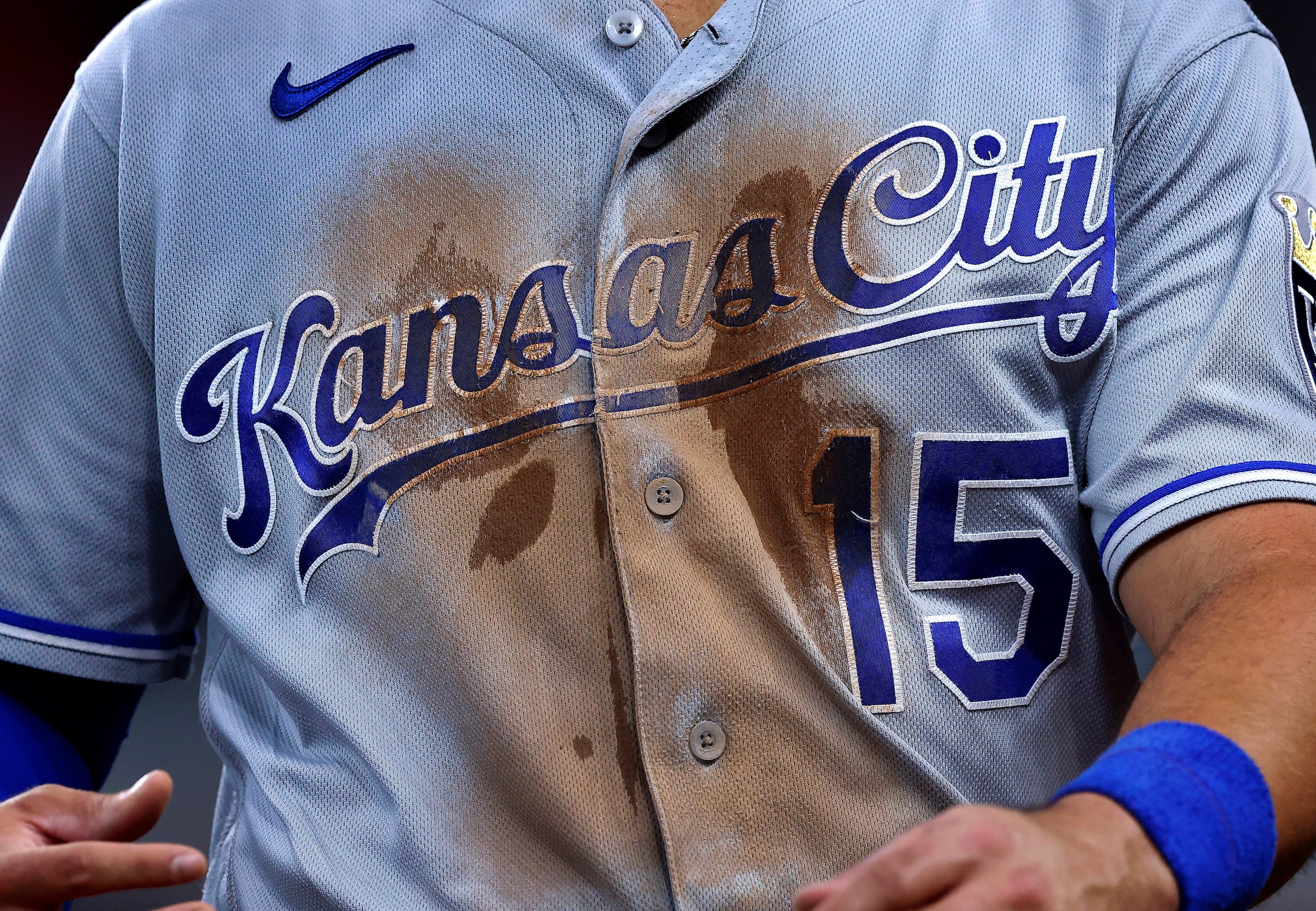 Kansas City Royals right fielder Whit Merrifield (15) caught a shirt full of dirt playing...