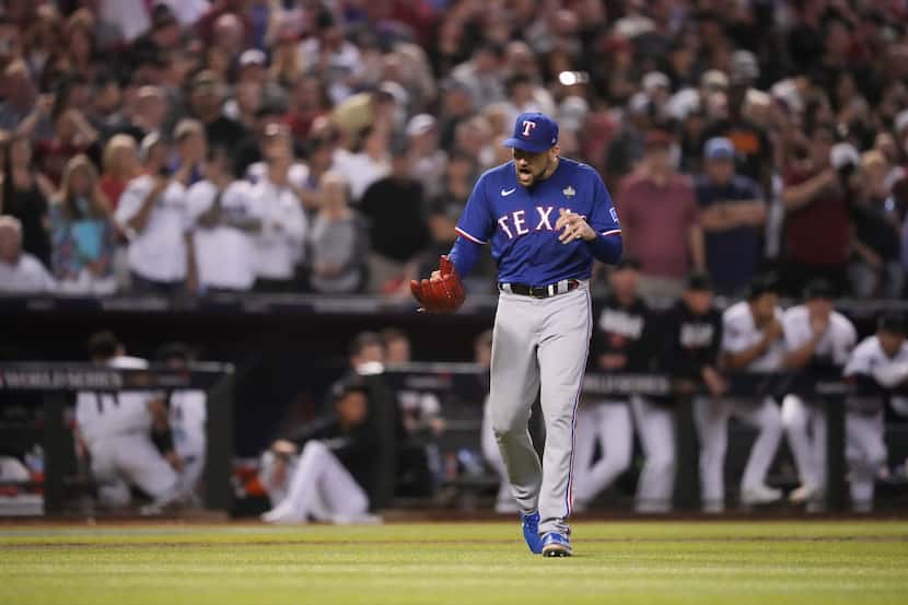 Texas Rangers starting pitcher Nathan Eovaldi celebrates the final out with the bases loaded...