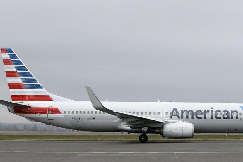 
In this Tuesday, Jan. 26, 2016, photo, an American Airlines flight taxis at Seattle-Tacoma...