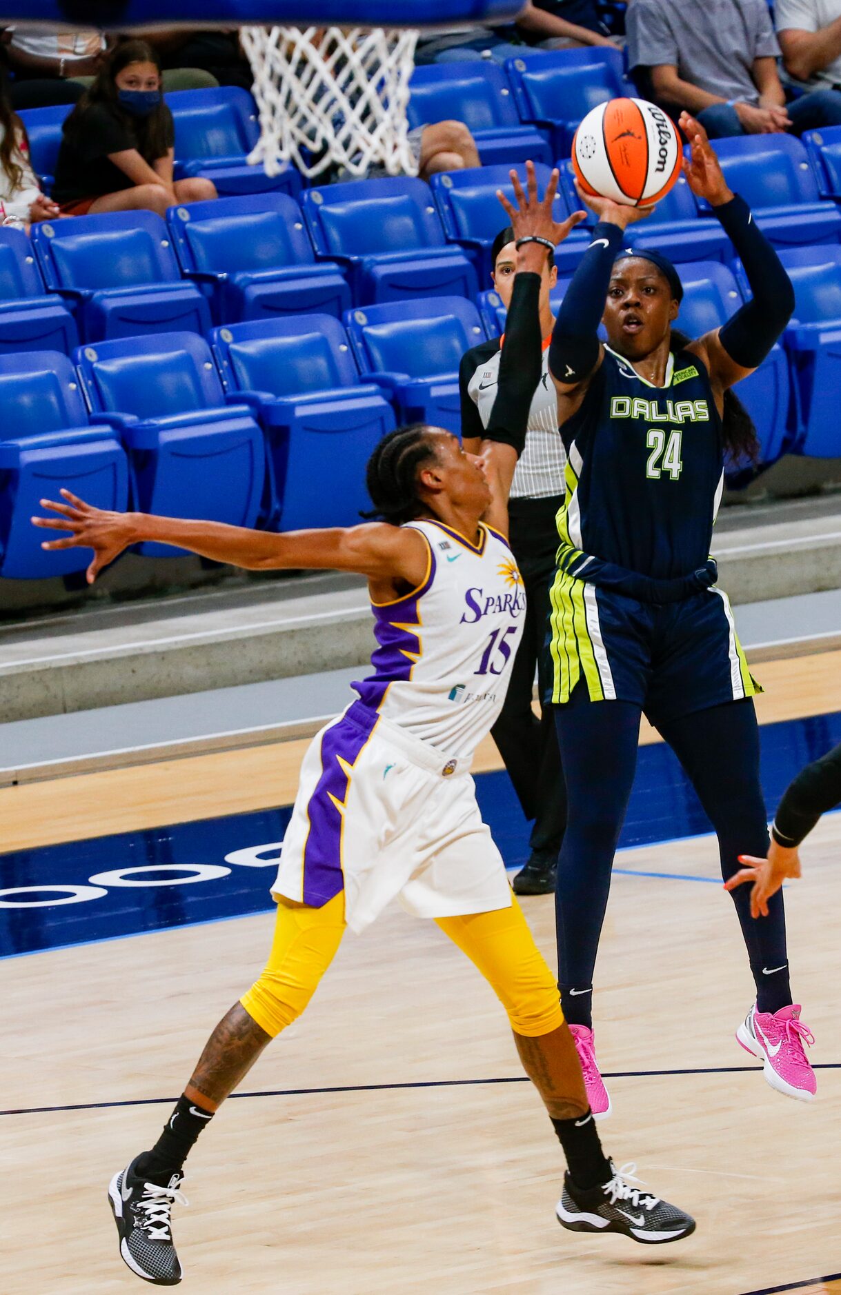 Dallas Wings guard Arike Ogunbowale (24) goes for a shot against Dallas Wings guard Allisha...