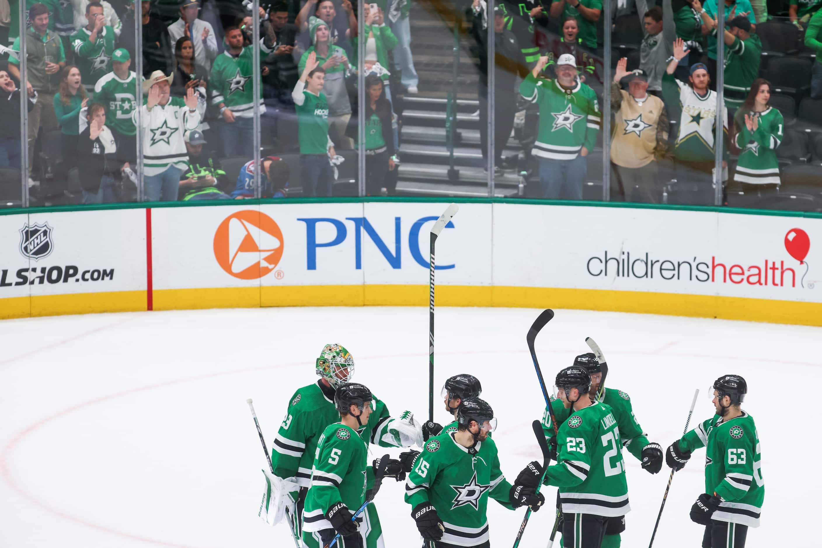 Dallas Stars fans cheer towards the ice rink following the team’s win in Game 2 of an NHL...