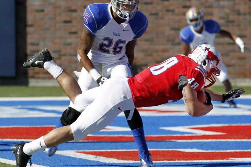 SMU running back Zach Line (48) dives into the end zone a touchdown in front of Tulsa...