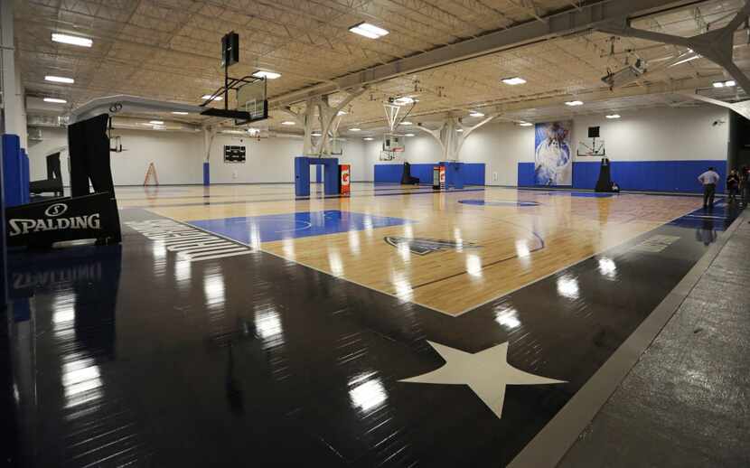 Two basketball courts stand at the ready at the Dallas Mavericks' new practice facility,...