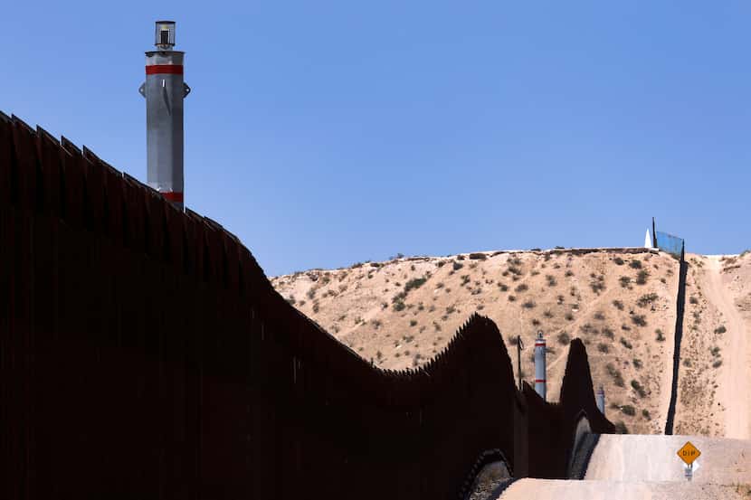 A U.S. Customs and Border Protection camera eyes movement along the border wall separating...