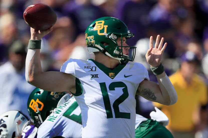 Baylor quarterback Charlie Brewer (12) passes to a teammate during the first half of an NCAA...