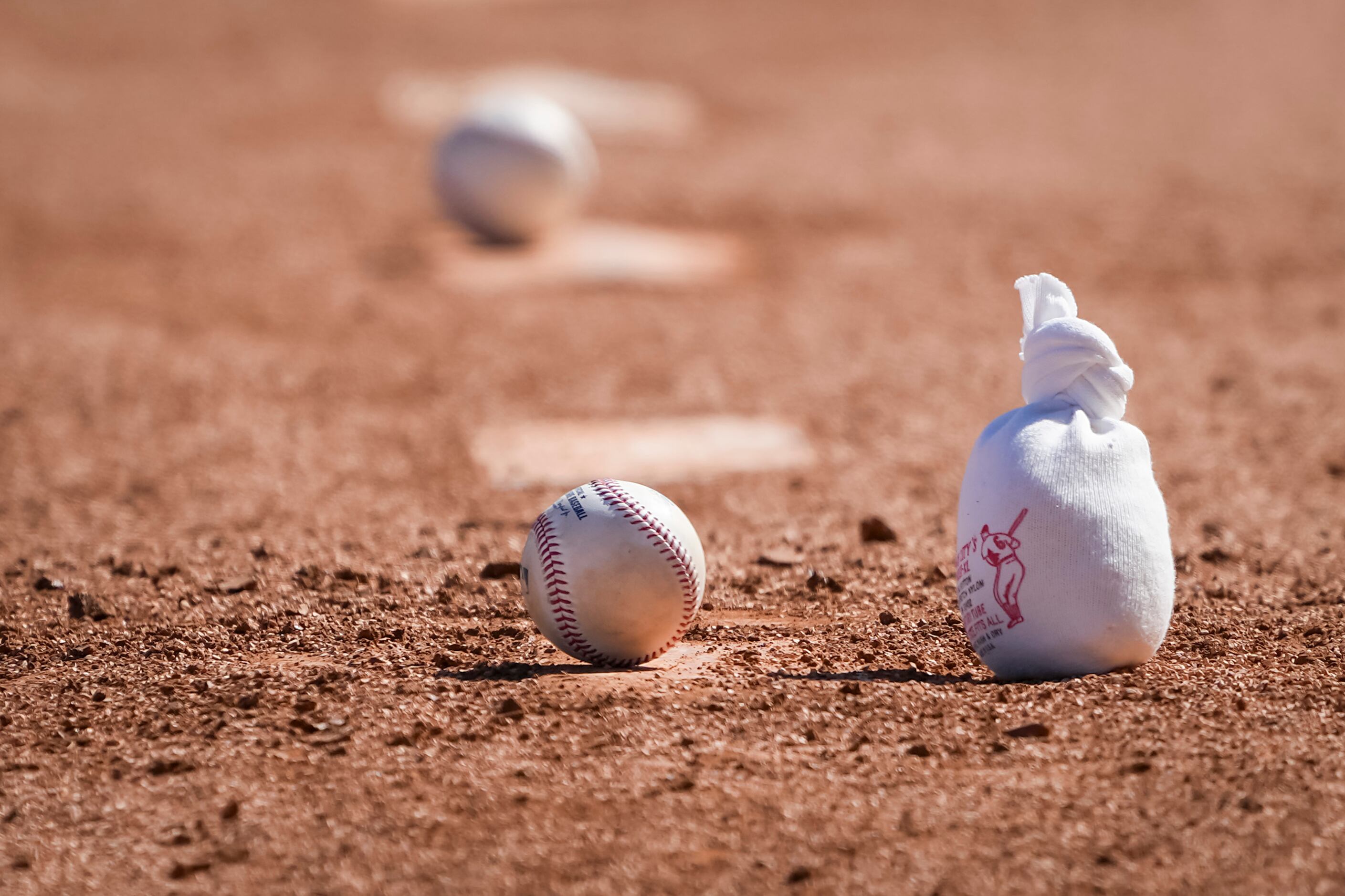 Balls and rosin bags sit ready for pitchers in the bullpen during Texas Rangers a spring...