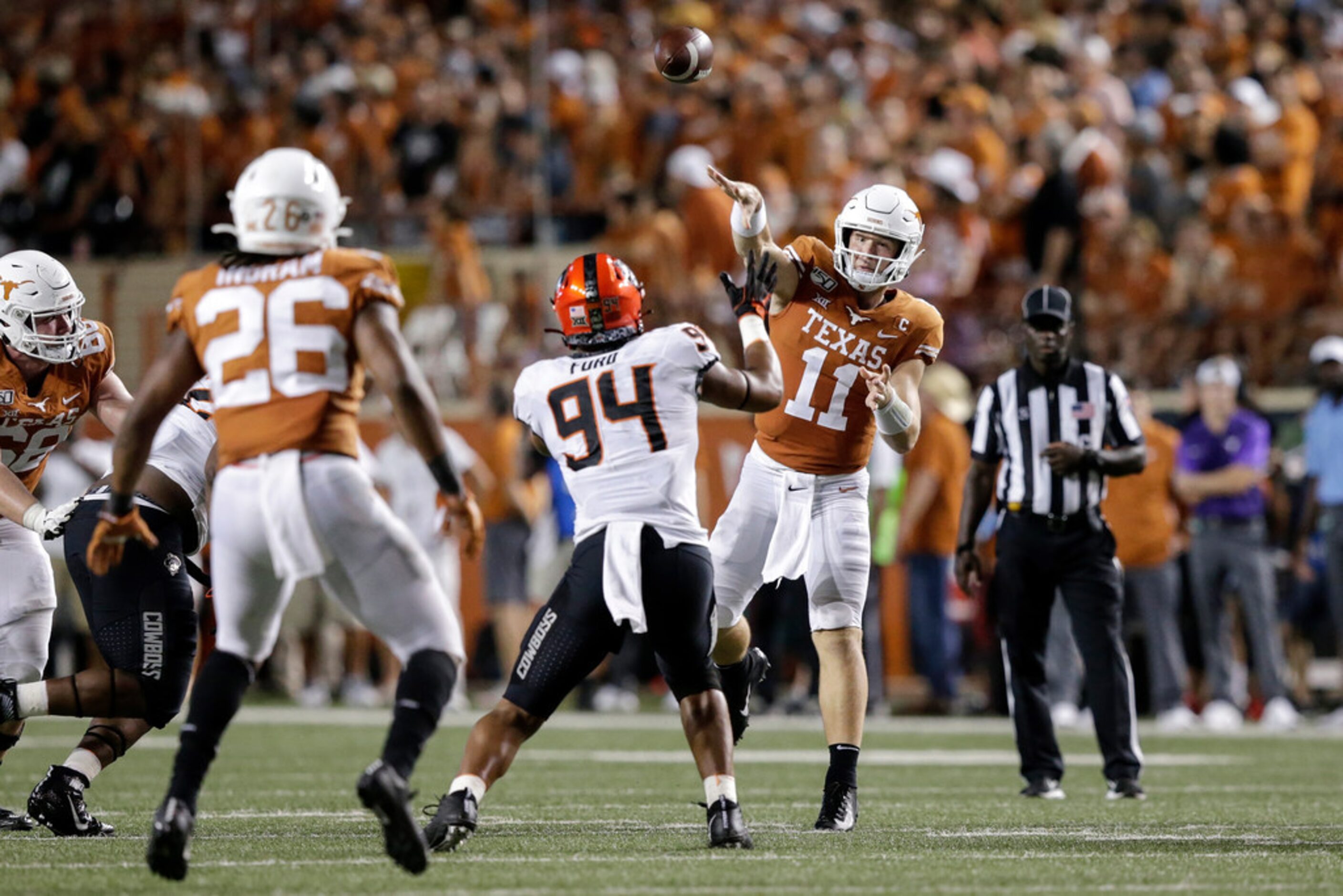 AUSTIN, TX - SEPTEMBER 21:  Sam Ehlinger #11 of the Texas Longhorns throws a pass in the...