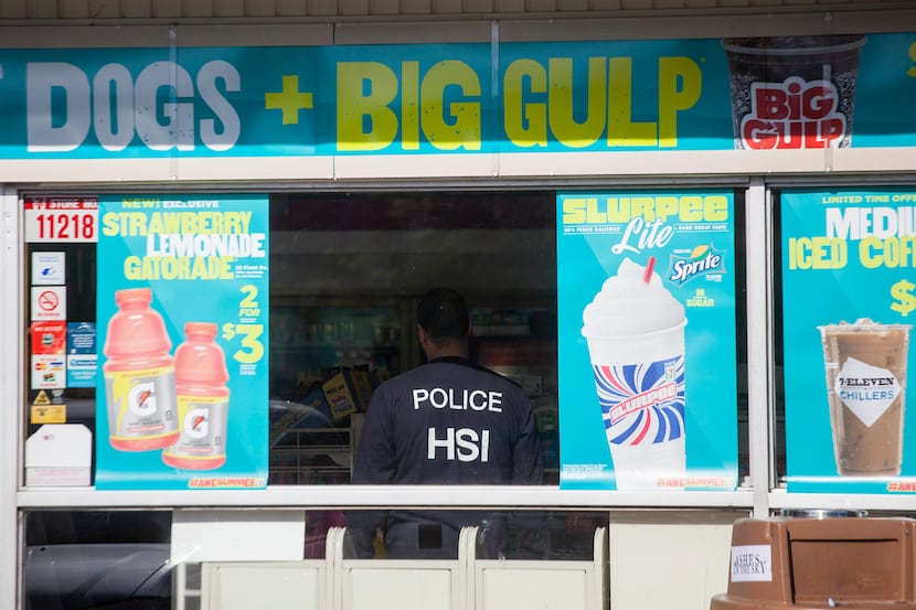 A Homeland Security officer at a 7-Eleven in Islip Terrace, N.Y., June 17, 2013. Federal...