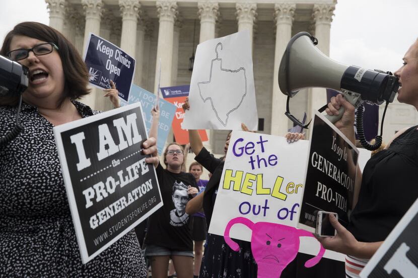Pro-abortion rights and anti-abortion protesters rally in front of the U.S. Supreme Court in...