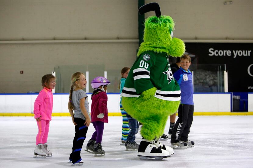 Dallas Stars mascot Victor E. Green skates with kids during public skate time at Dr Pepper...