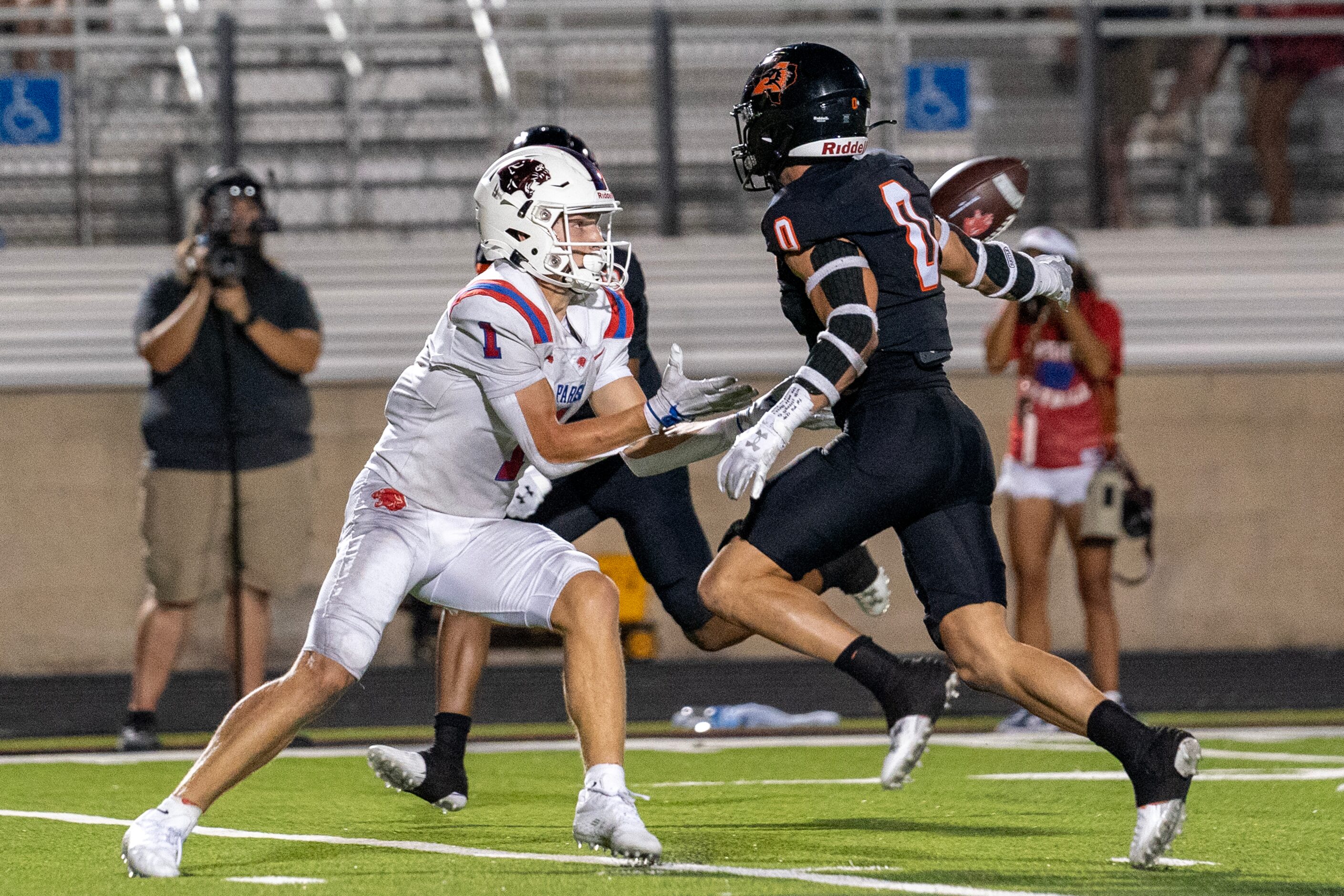 Parish Episcopal senior wide receiver Hutch Crow (1) hauls in a pass in front of Aledo...