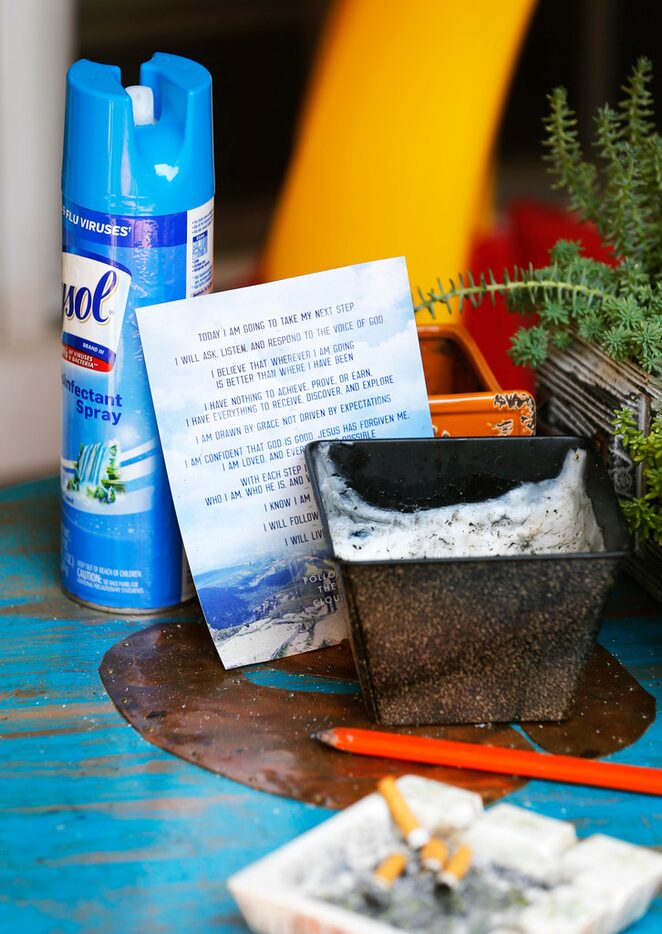 Detail of a religious card in the patio area of the apartment belonging to a man that is...