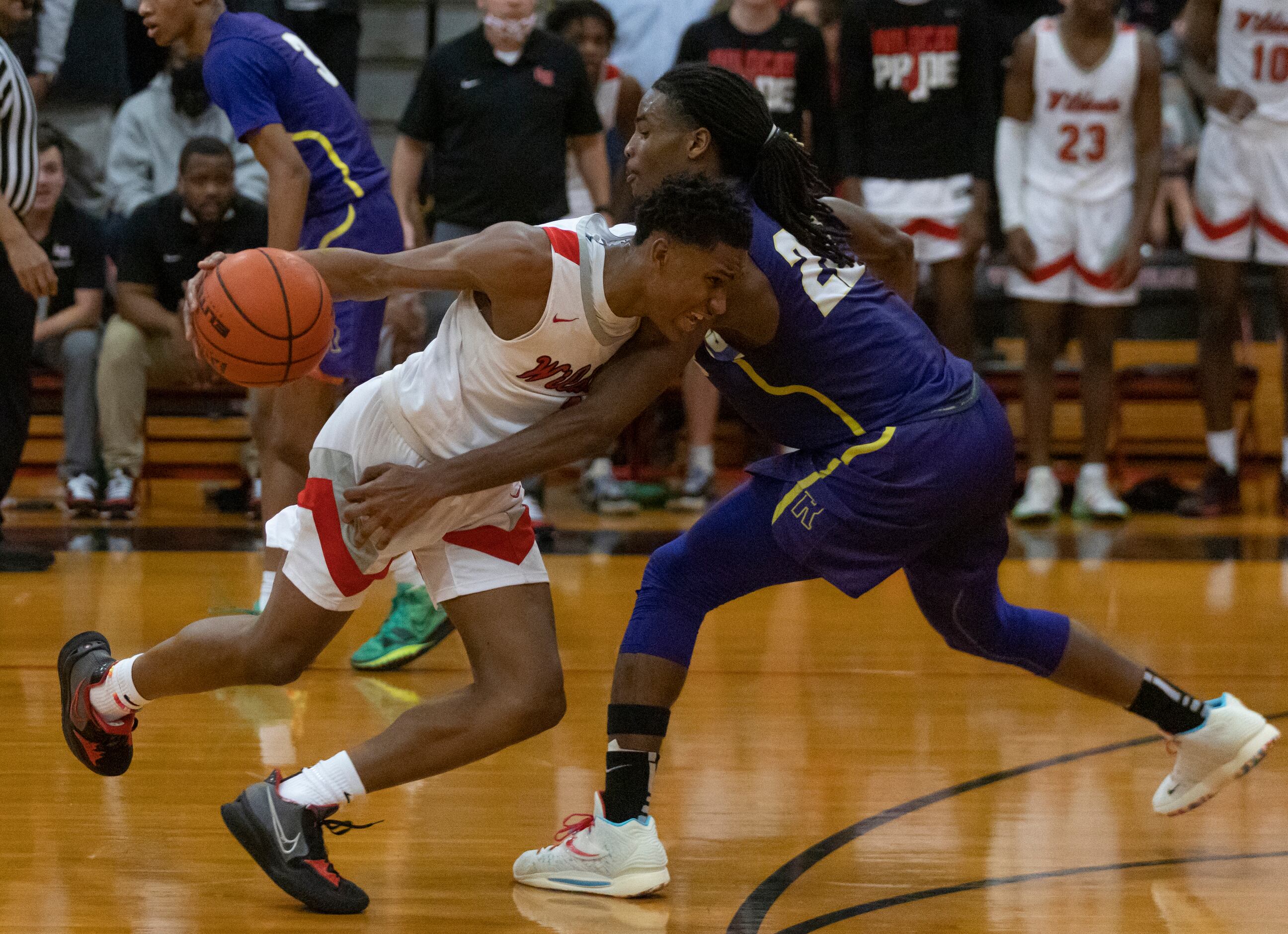 A player from Lake Highlands High School gets blocked by Richardson High School Cason...