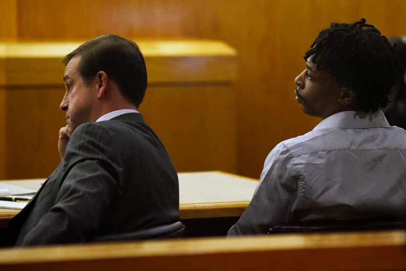 Attorney Jeff Lehman, left, and defendant Desmond Jones, right, during his trial inside the...