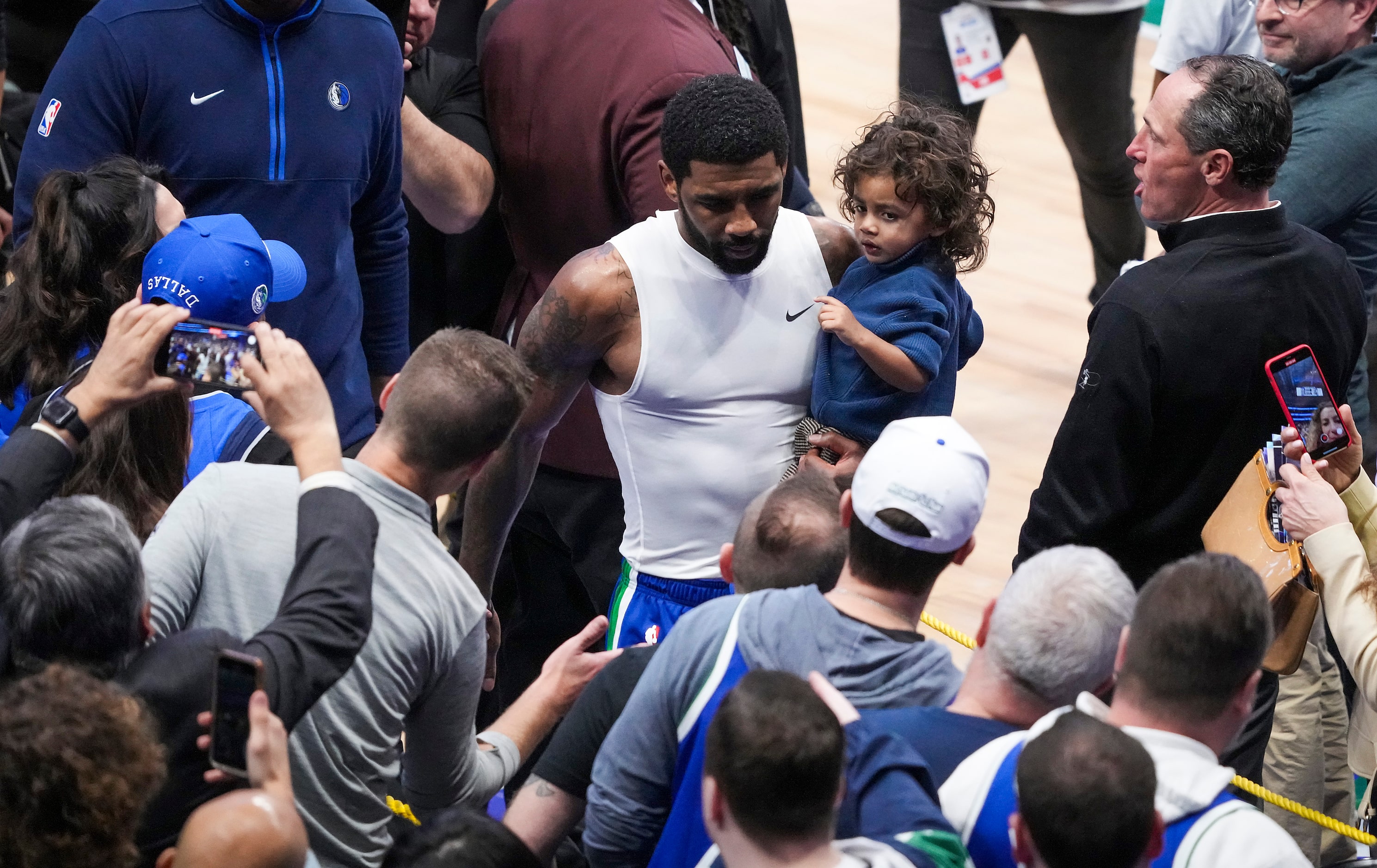 Dallas Mavericks guard Kyrie Irving leaves the court after a 124-121 loss to the Minnesota...