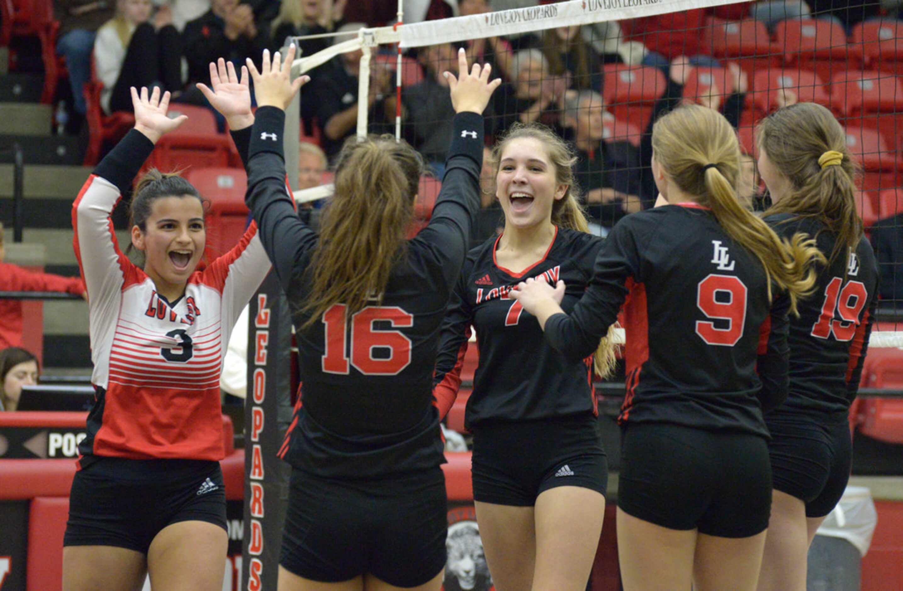 Lovejoy's Callie Kemohah (3) celebrates with teammates after their match clinching point...