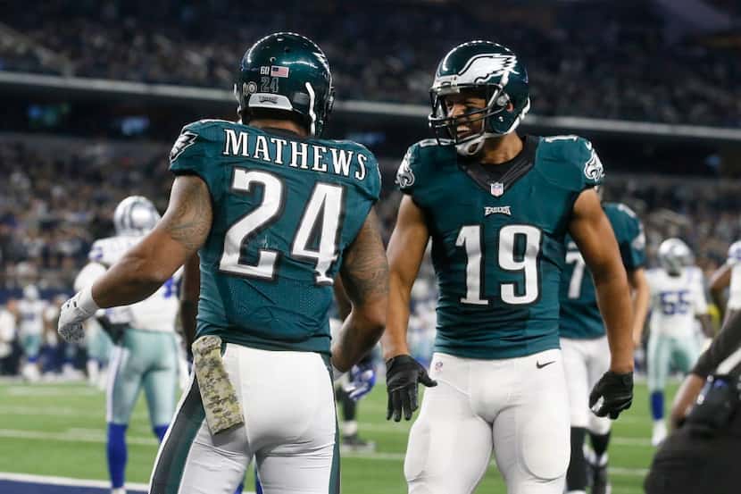 Philadelphia Eagles' Ryan Mathews (24) and Miles Austin celebrate a touchdown run by...