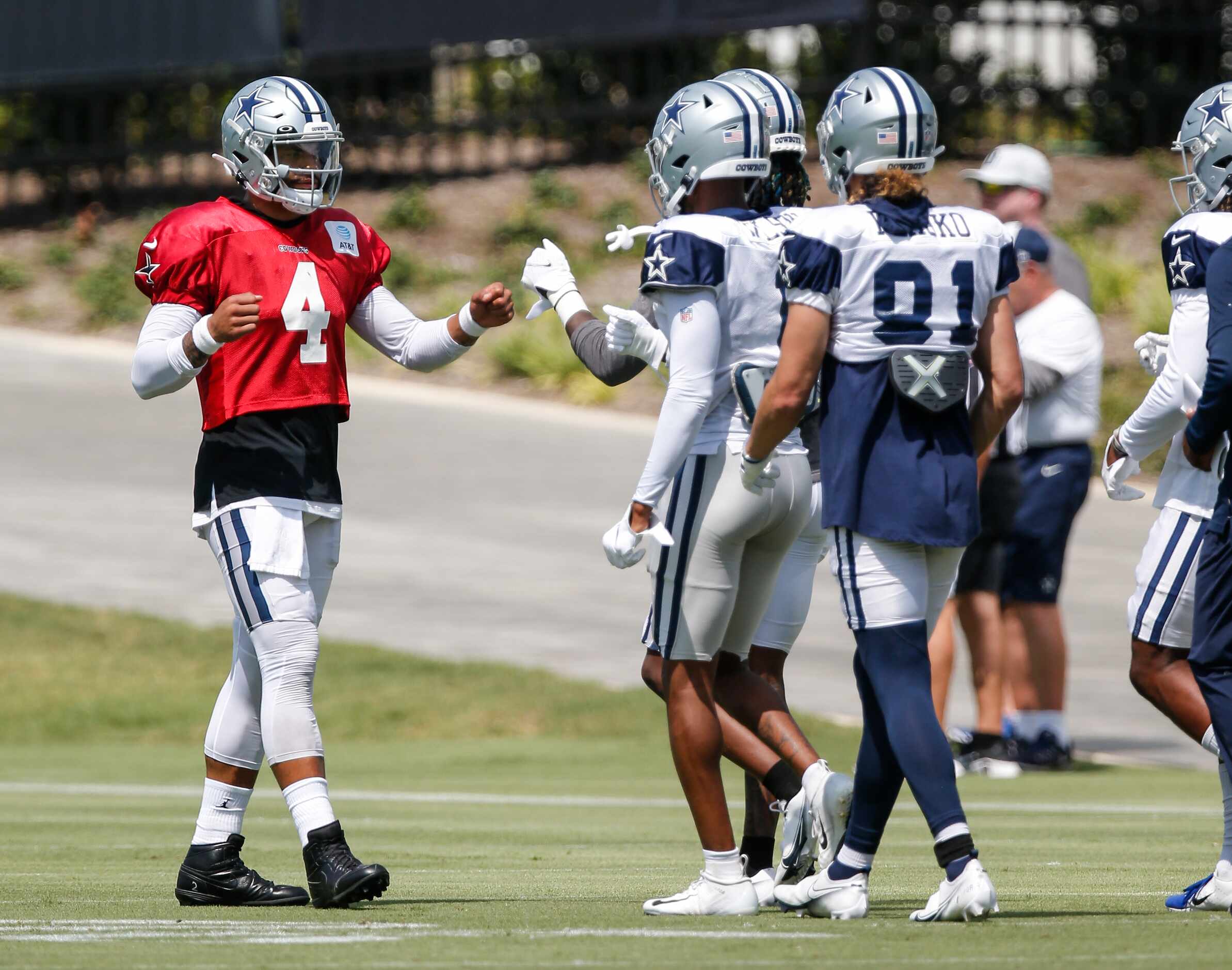 Dallas Cowboys quarterback Dak Prescott (4) greets his teammates during practice at The Star...
