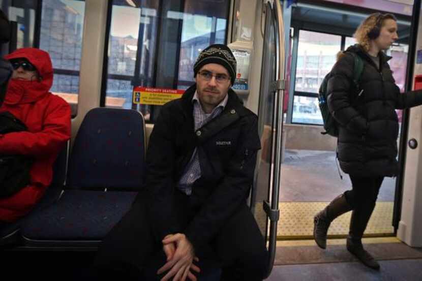 
Jonathan Reiner, 26, of St. Paul, Minn., rides a light-rail train to his Minneapolis law...