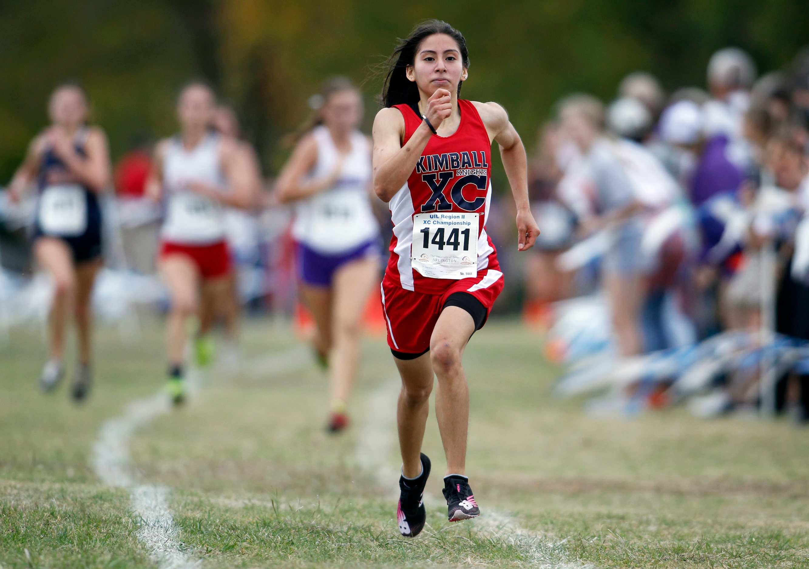 Dallas Kimball senior Juliana Molina (1441) sprints to the finish line in the Girls Class 5A...