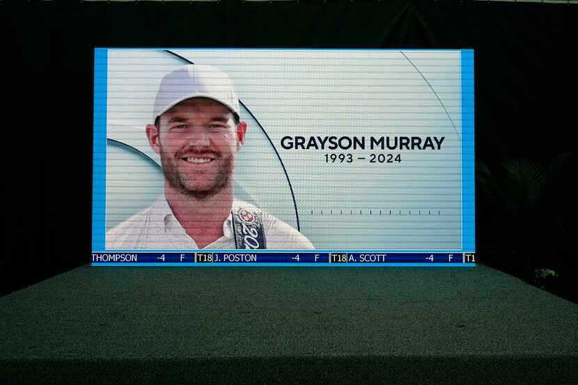 A golf broadcast by CBS is played on an empty stage at the media center showing a photo of...