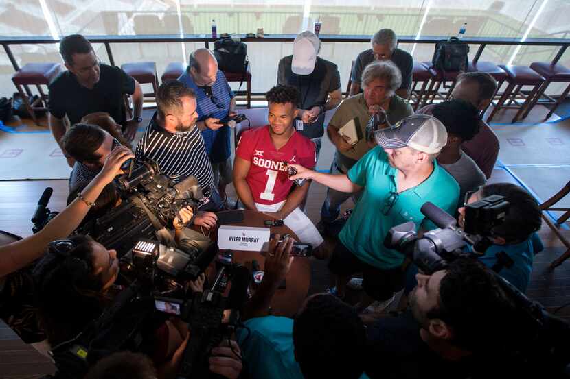 Oklahoma quarterback Kyler Murray (1) meets with reporters during Sooners media day at...
