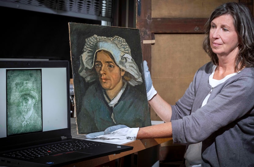 Senior Conservator Lesley Stevenson views "Head of a Peasant Woman" alongside an X-ray image...