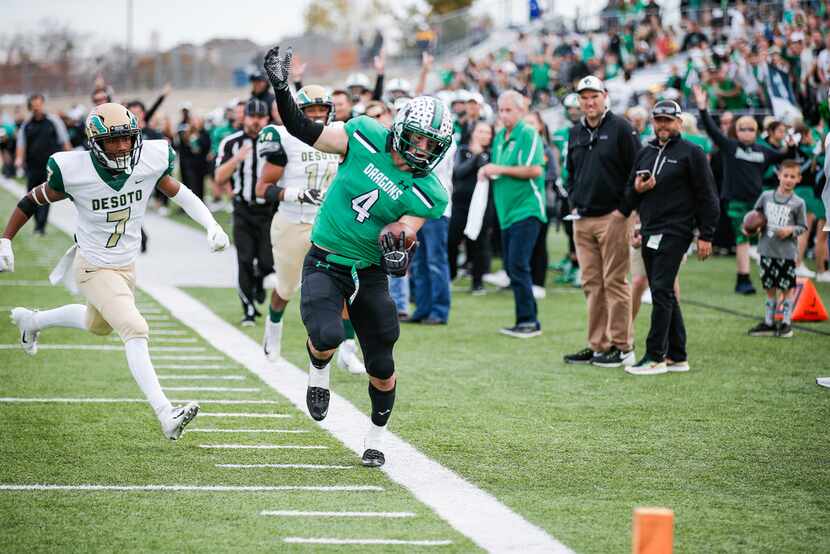 TXHSFB Southlake Carroll senior running back TJ McDaniel (4) is forced out of bounds by...