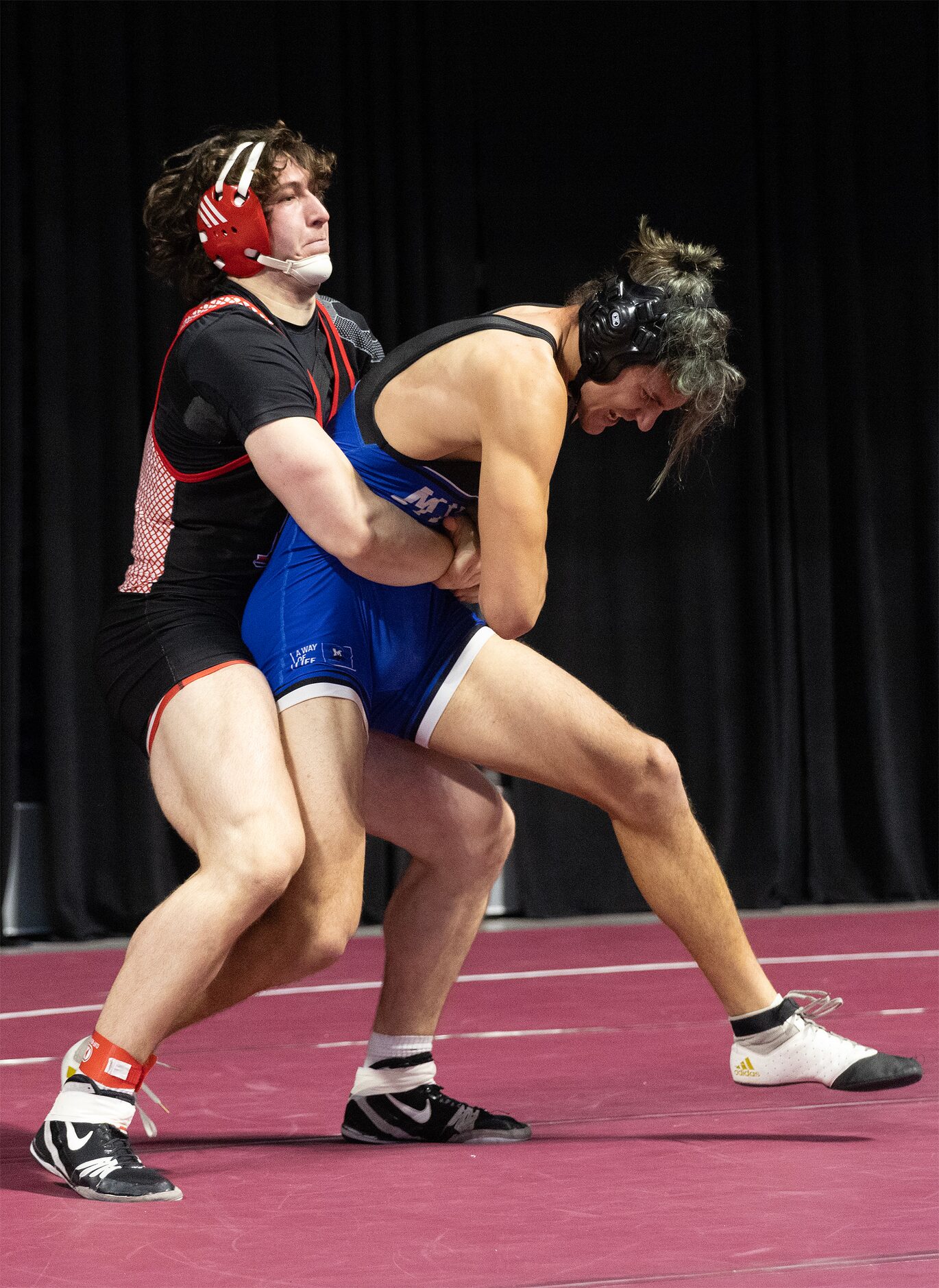 Payton Pierce from Lovejoy (left) wrestles Jack Ashley from Midlothian in the 5A boys 215...