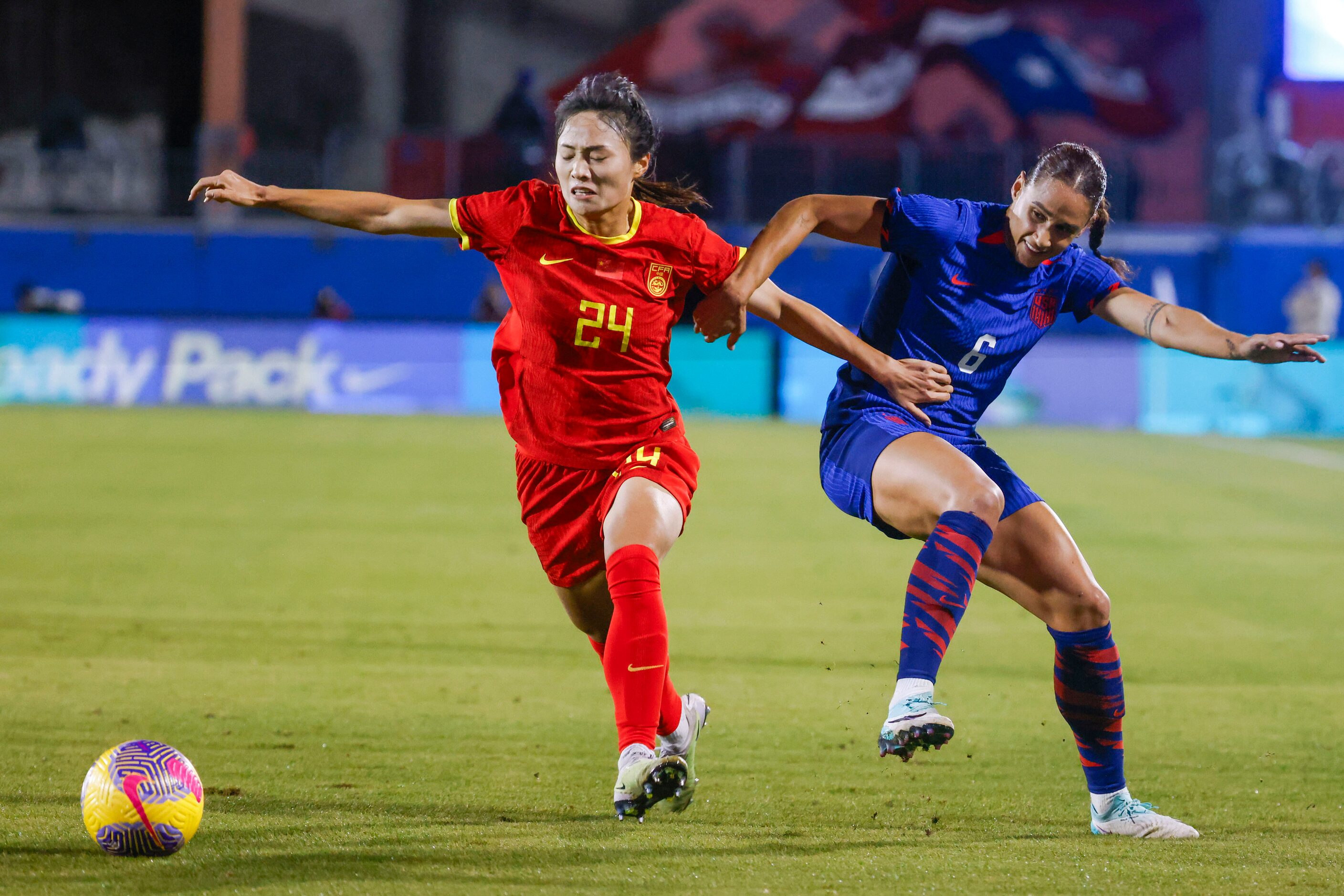 China’s Jin Kun (left) battles for possession against United State’s Lynn Williams during...