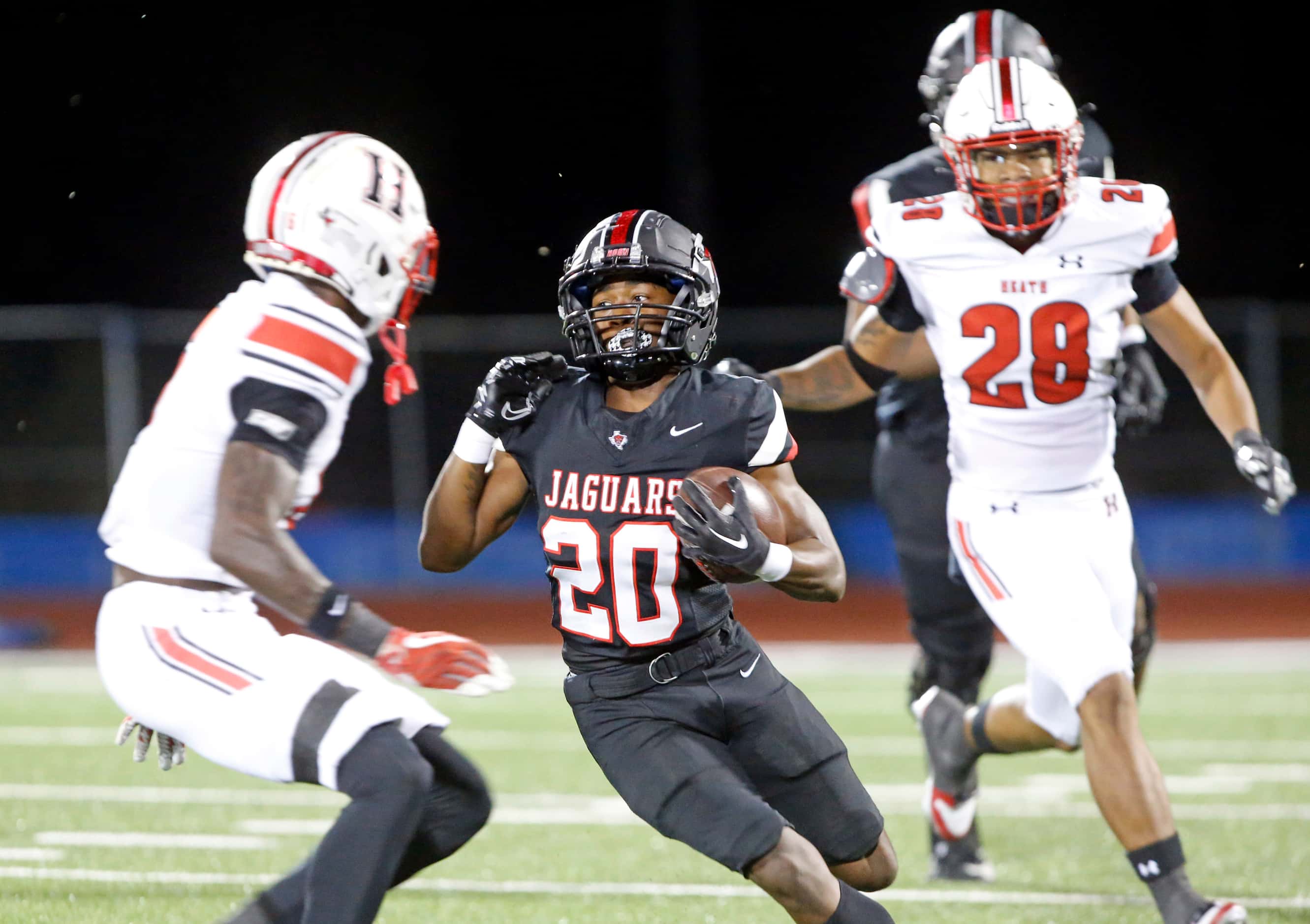 Mesquite Horn’s Rodney Franklin (20) picks up yardage, during the first half of a high...