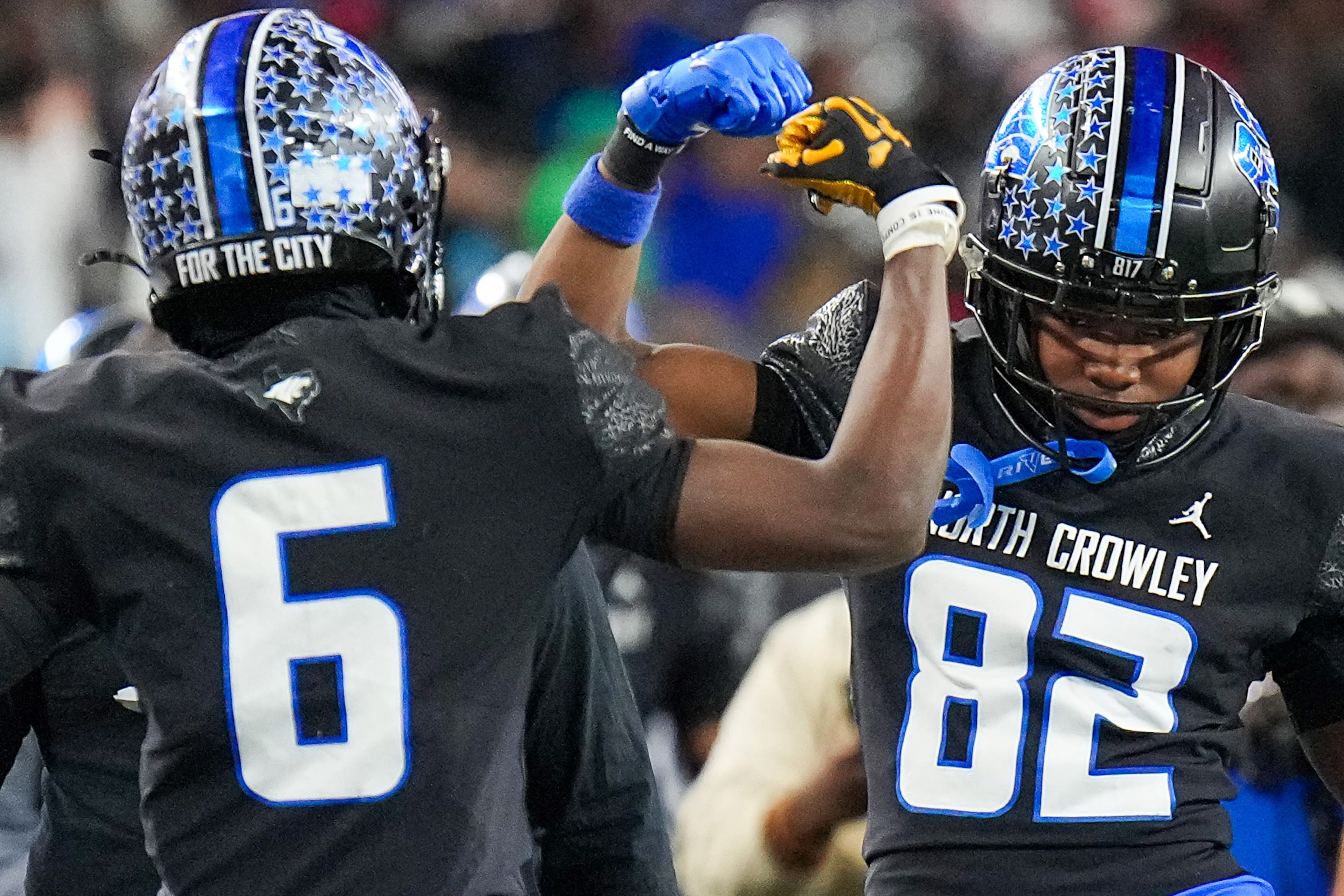 North Crowley wide receiver Quentin Gibson (6) celebrates with Malachi Releford (82) after...