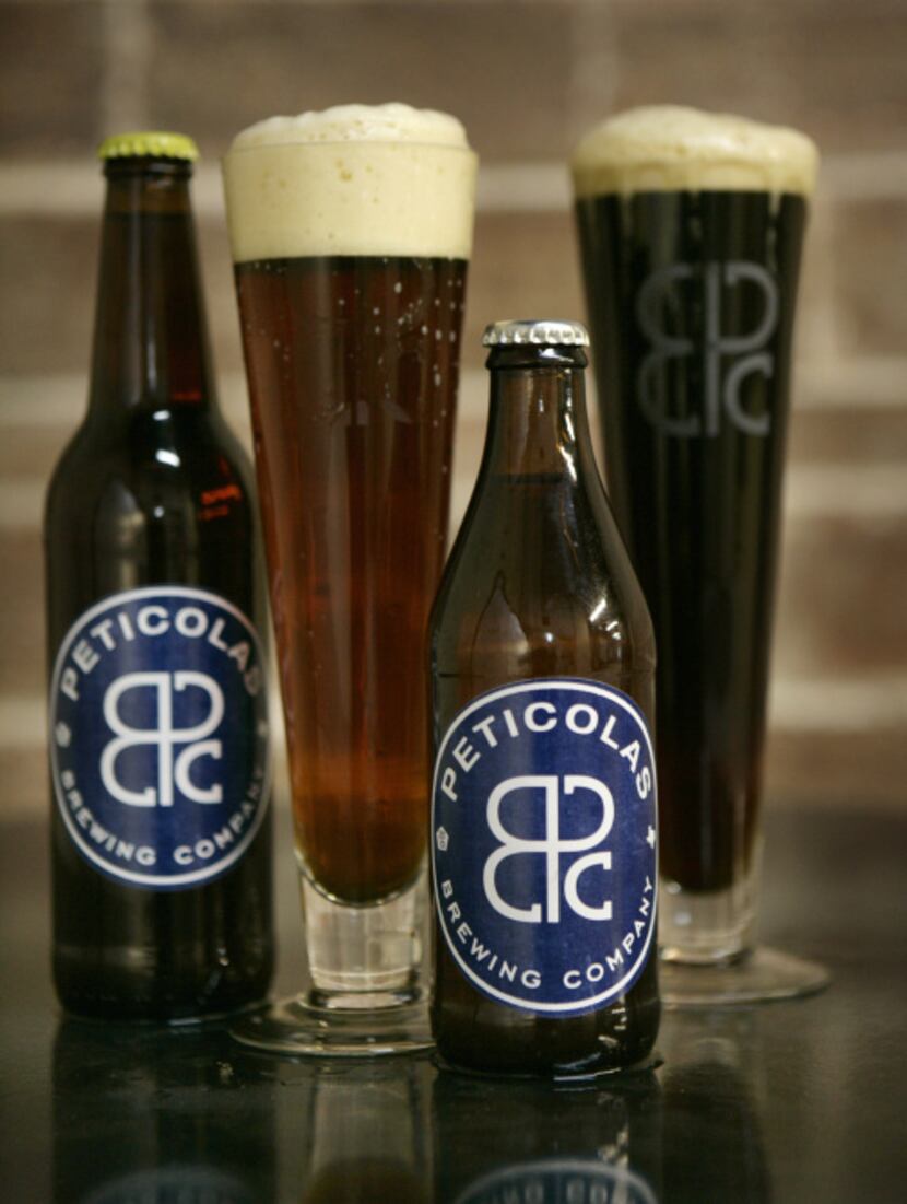 In the glasses are Velvet Hammer, left, and Great Scot! beers from Peticolas Brewing...
