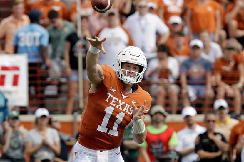 Texas quarterback Sam Ehlinger (11) throws against Baylor during the first half of an NCAA...
